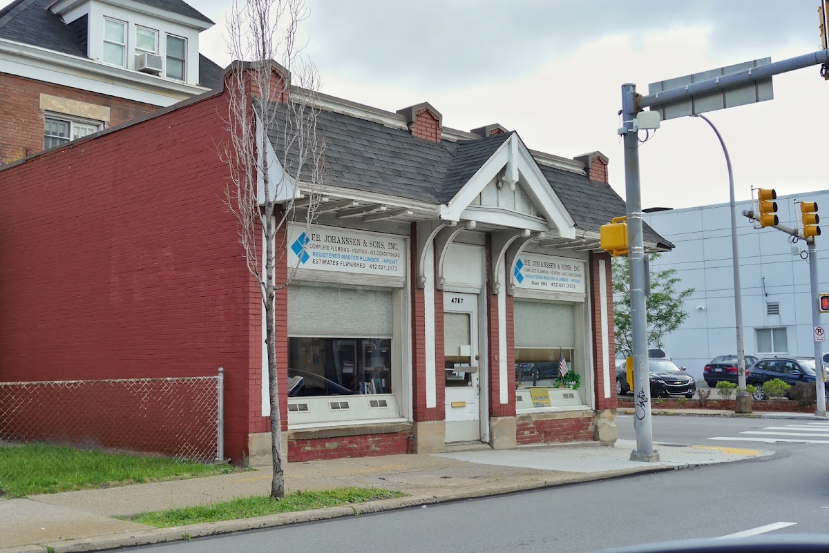 F.E. Johanssen and Sons Inc storefront on Baum Boulevard with hand-painted window signage reading Since 1915